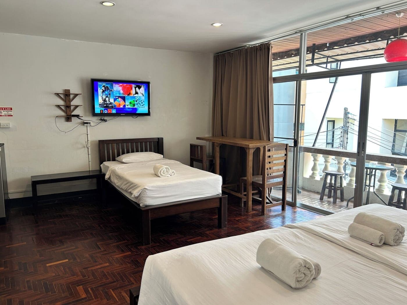 Triple Room with Balcony — 45 m² · queen + single · balcony · garden view